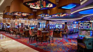 Tabel pembayaran Three Card Poker di townscaper yang menunjukkan payout untuk Ante, Play, dan Pair Plus
